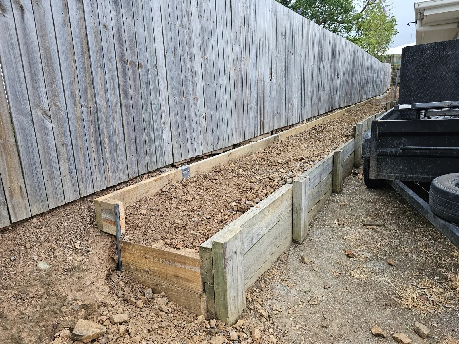 New timber retaining wall under construction